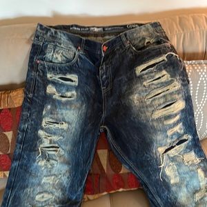 Pair of torn Jordan Craig street style jeans size 42/32